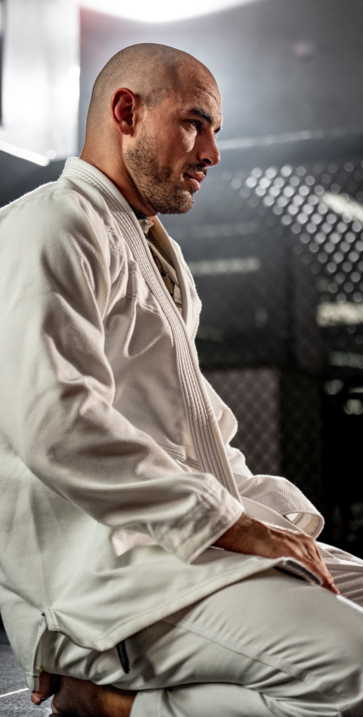 Founder kneeling on the mat during training