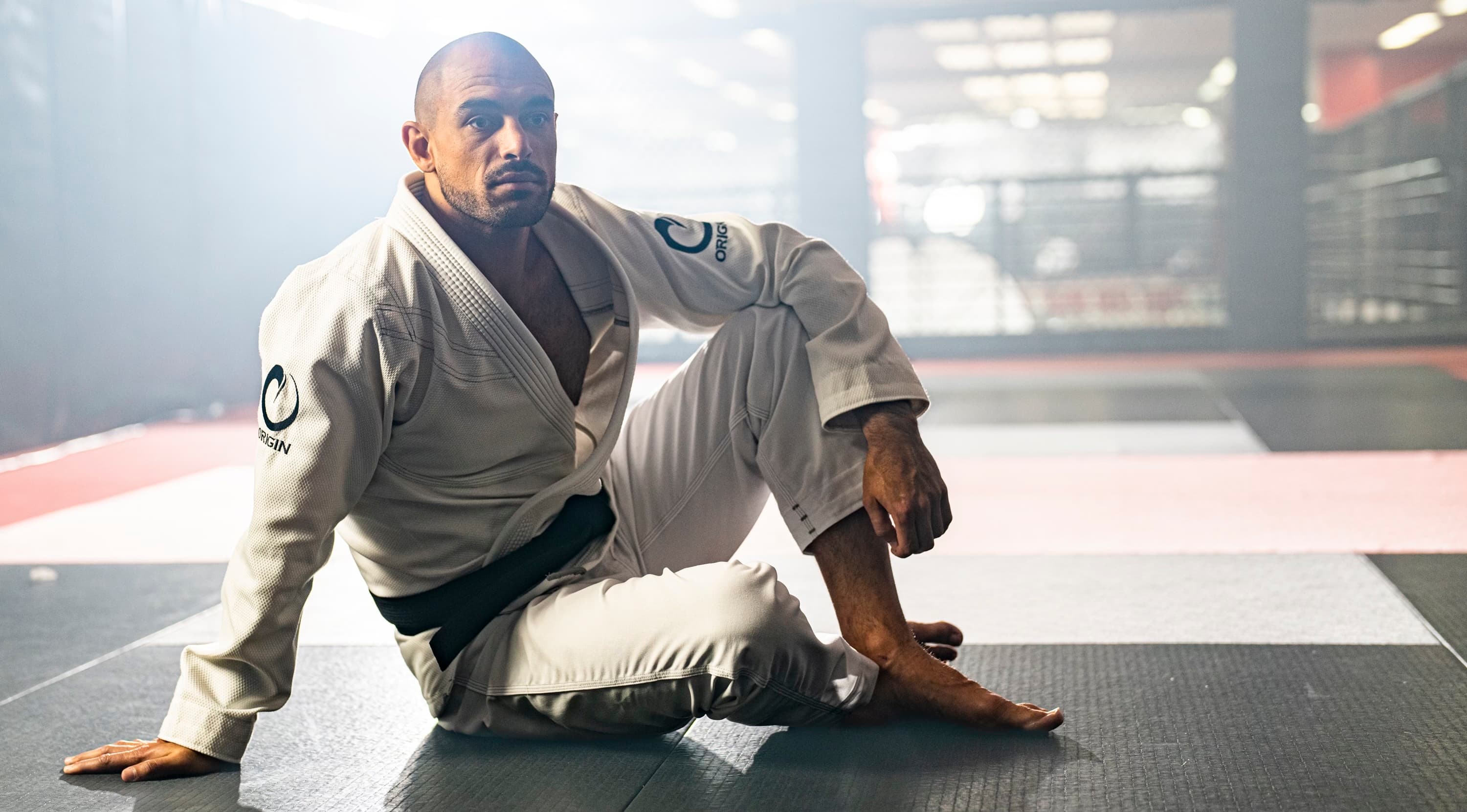 Founder seated in backlit training space