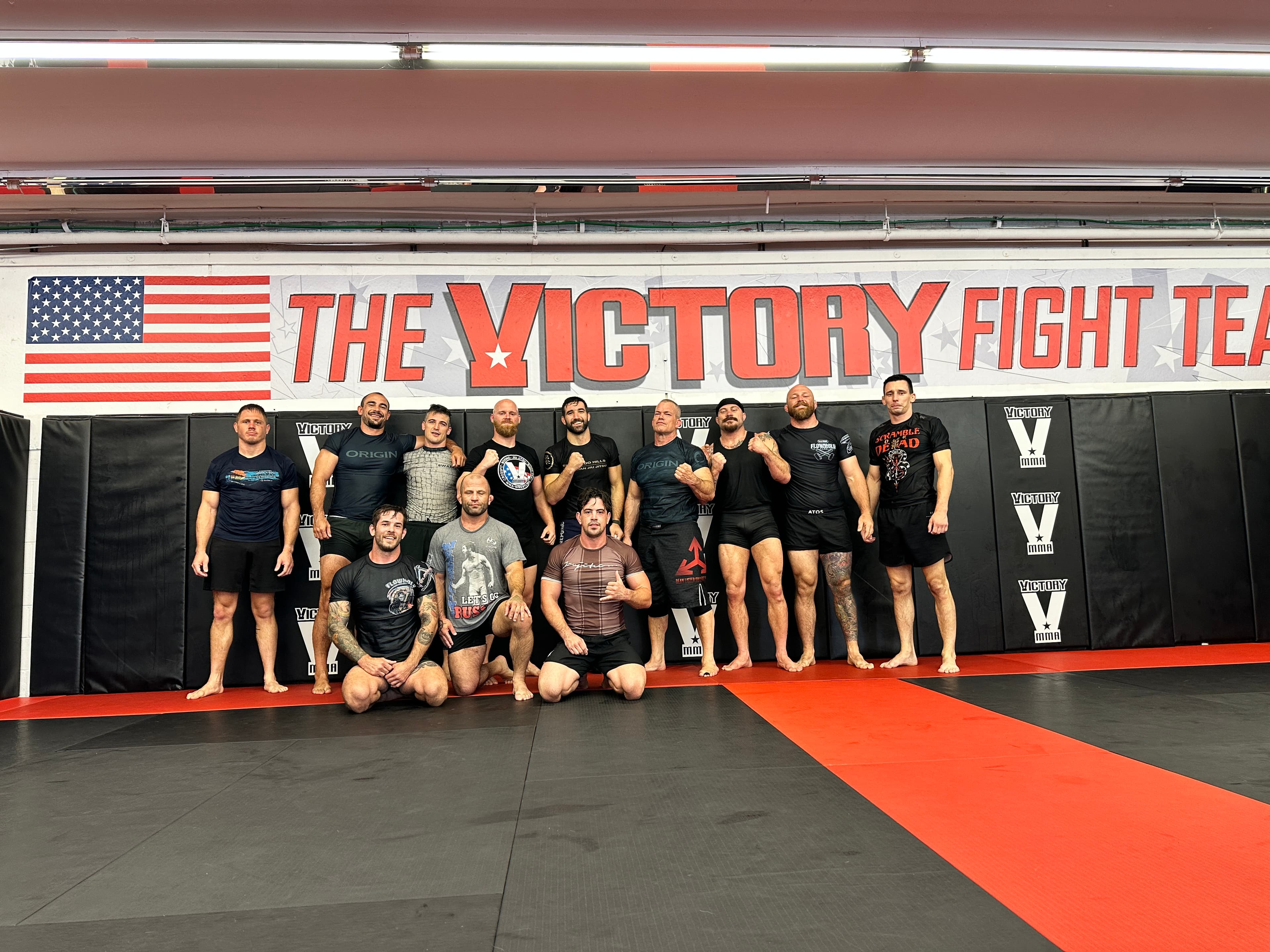 Victory team standing together after class